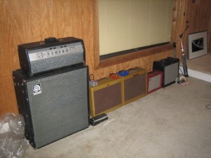 Wall of amps and dog toys.